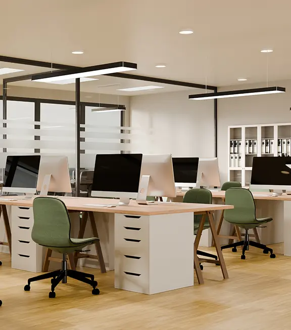 Rows of empty desks in a modern office
