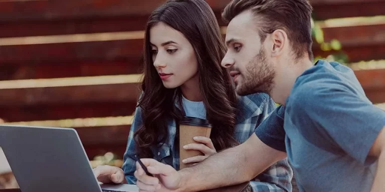 Coworkers booking a meeting together