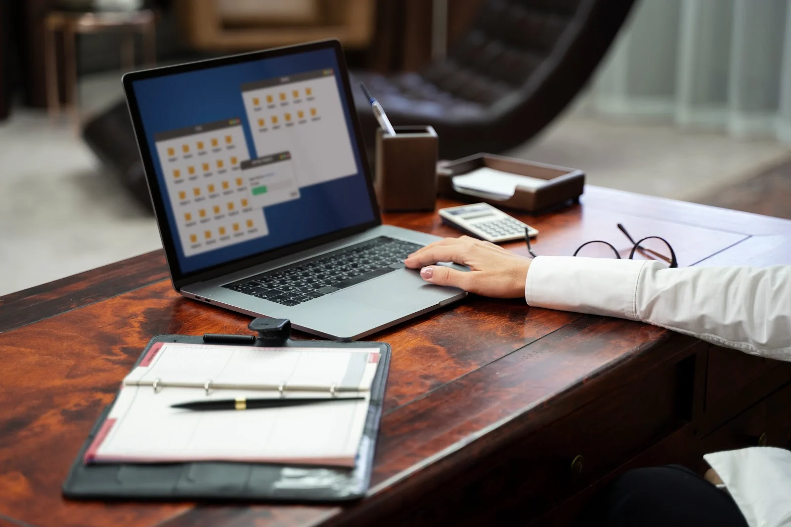 person booking desks on a laptop