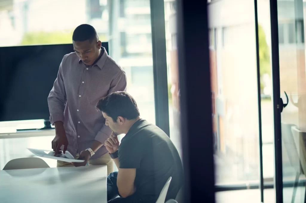 men talking in an office